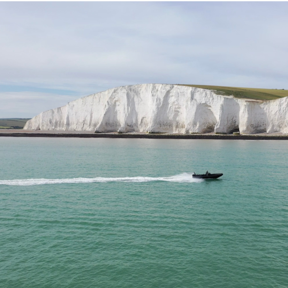 Brighton Powerboat with the white cliffs in the background 